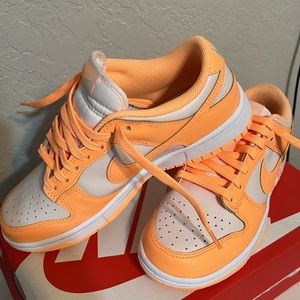Brand new women’s 7.5 peach cream Nike dunks.